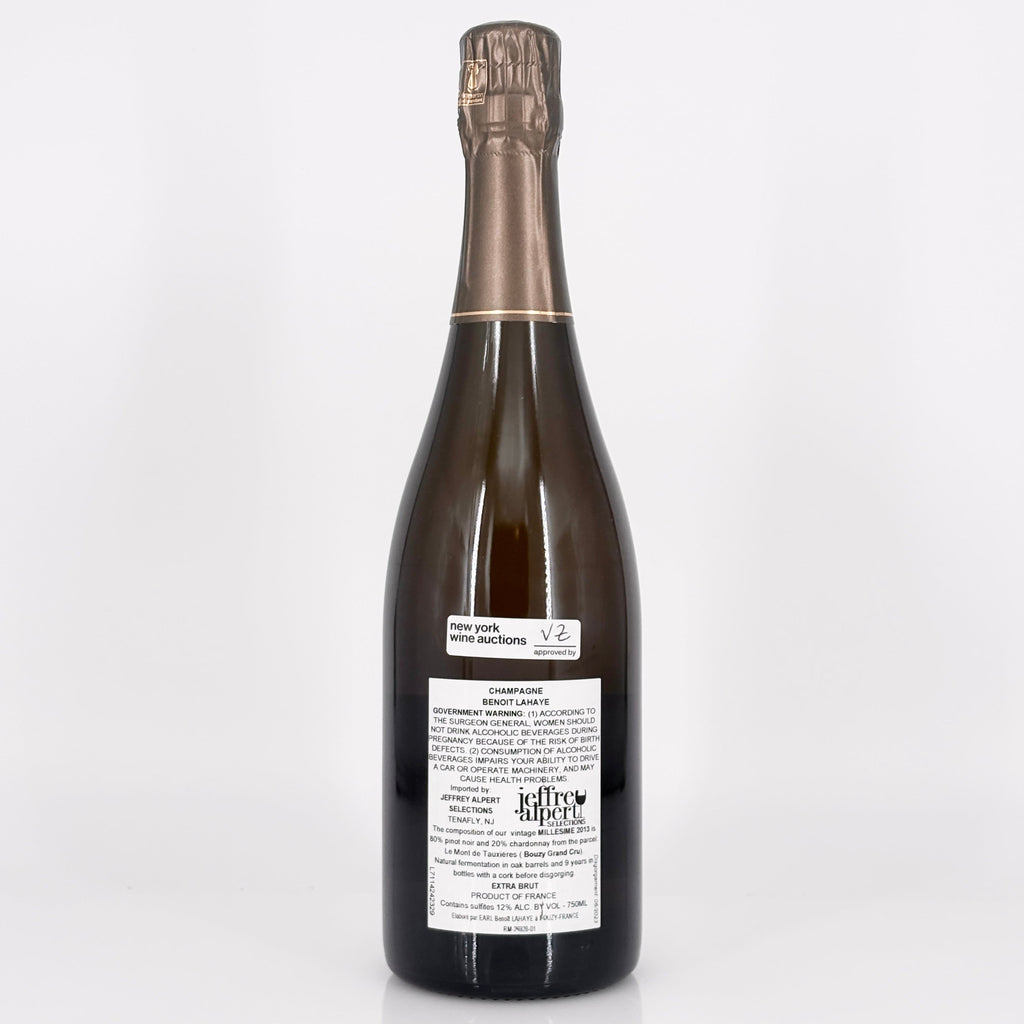 Bottle of champagne with a label on a white background