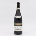 Wine bottle with 'Riserva' label on a white background
