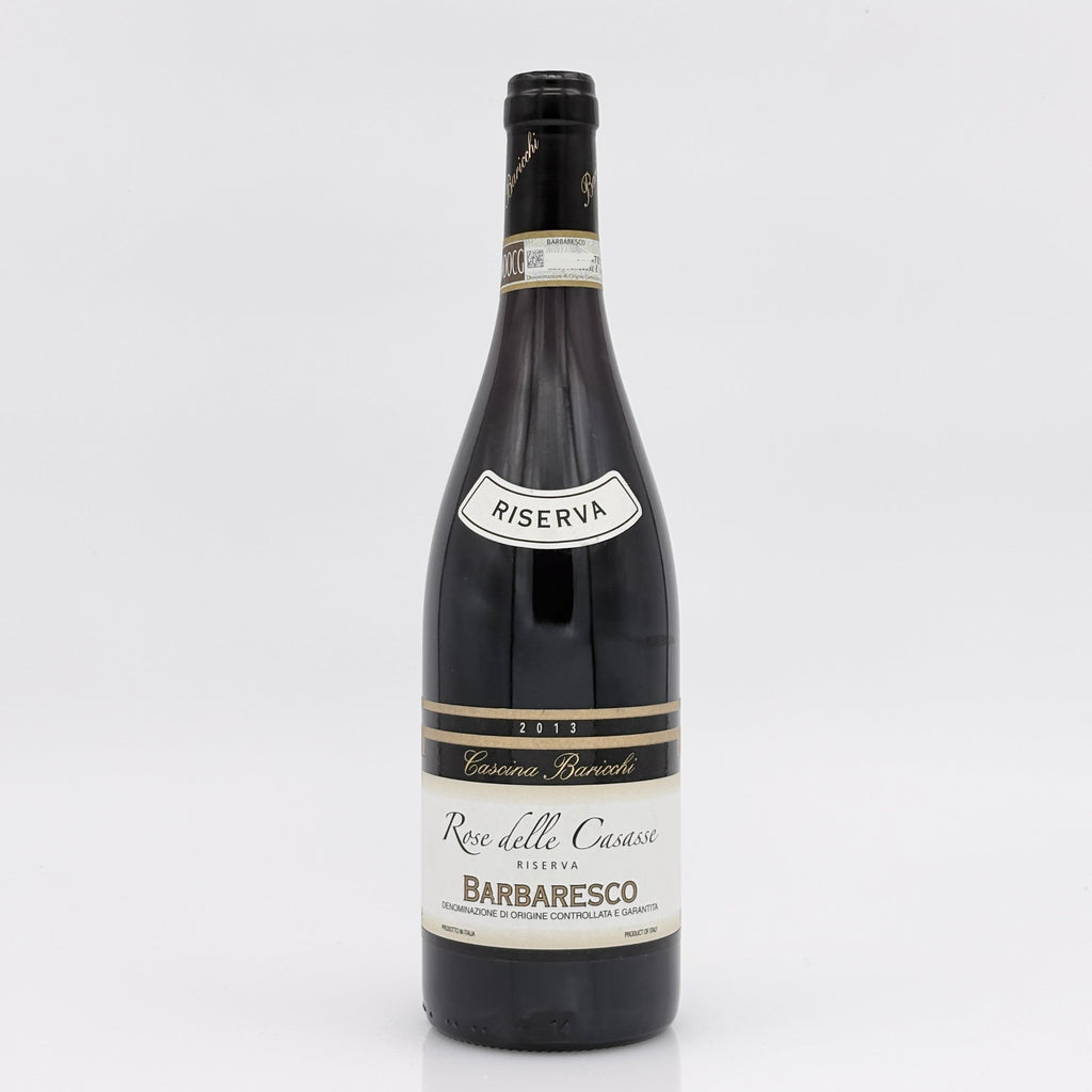 Wine bottle with 'Riserva' label on a white background