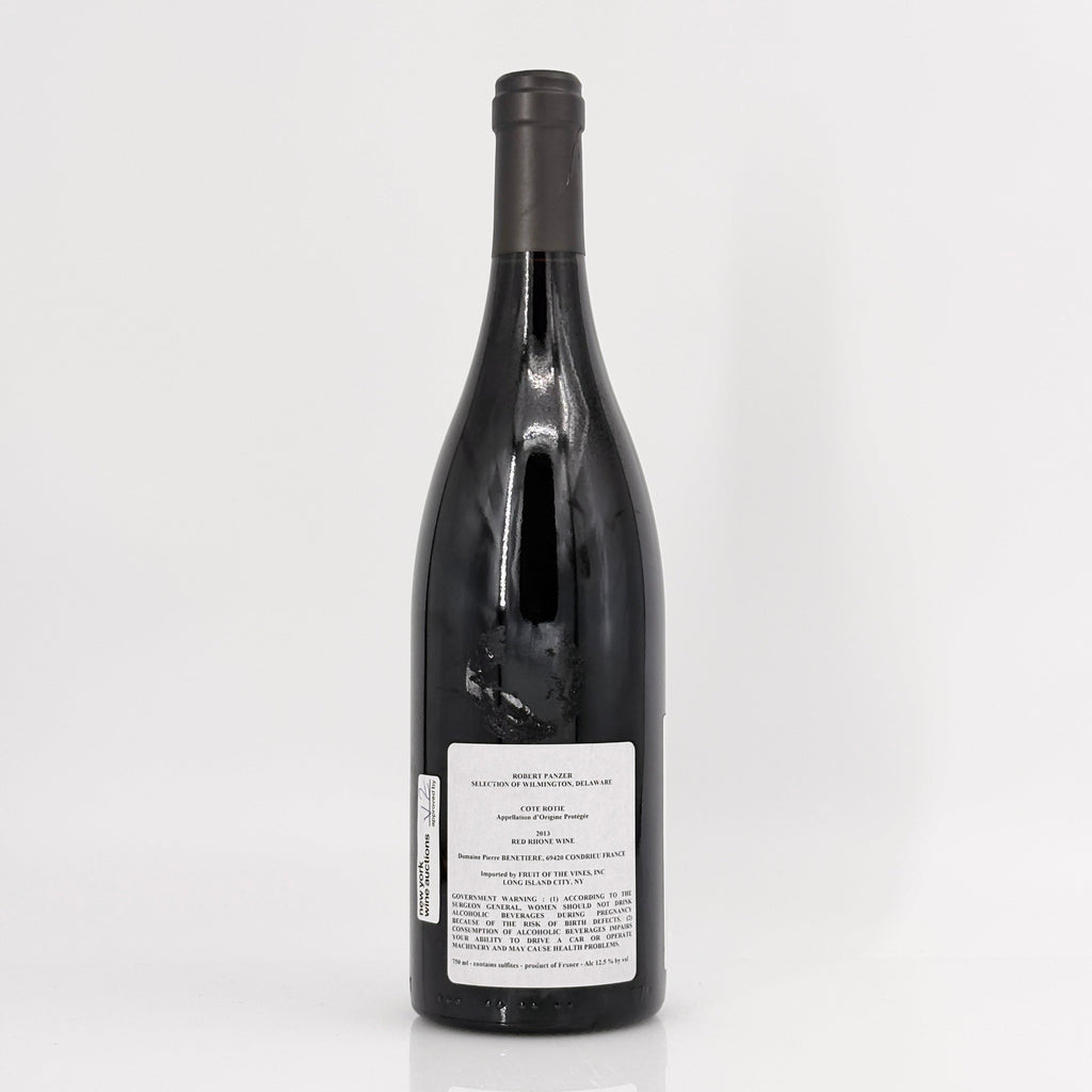 Black wine bottle with label on a white background