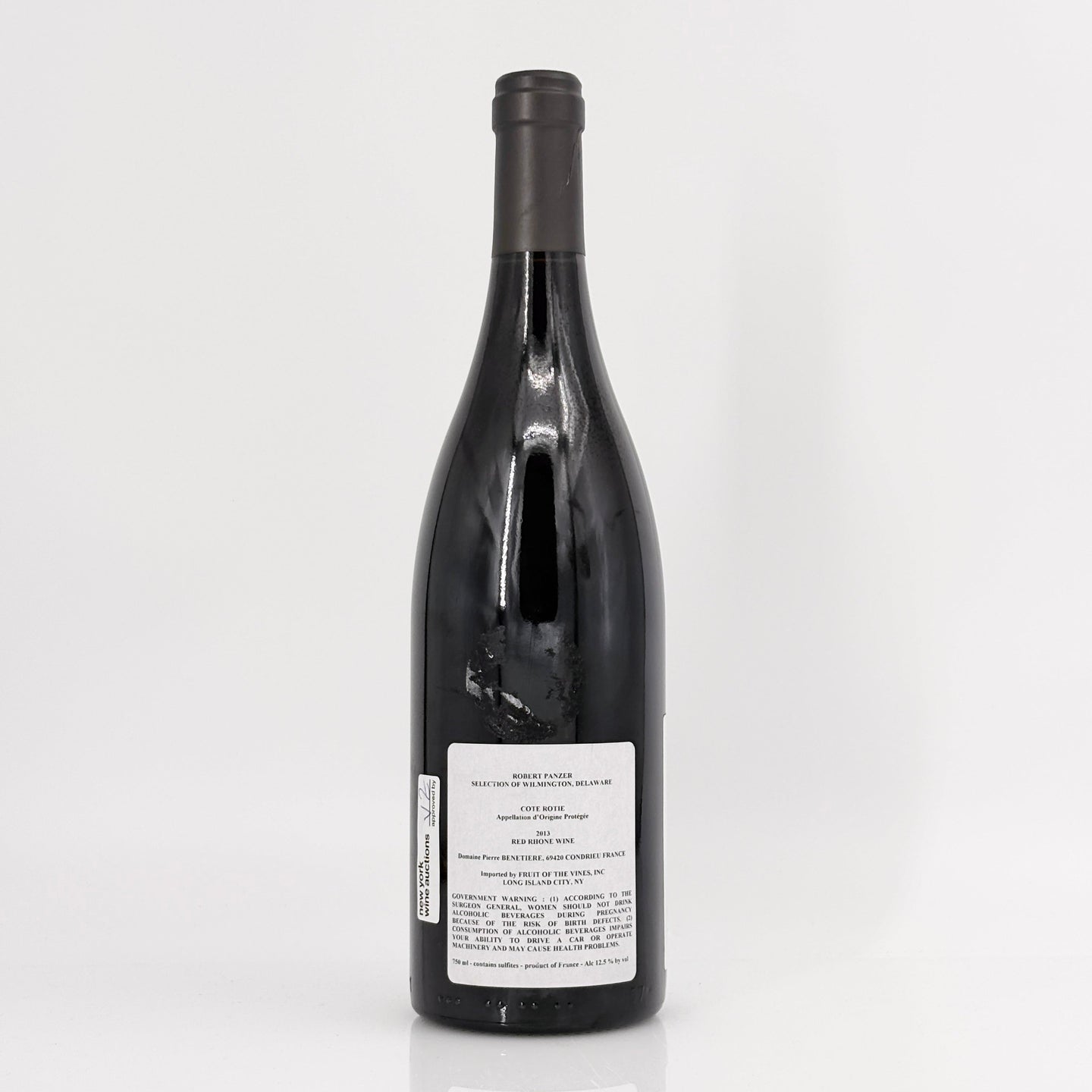 Black wine bottle with label on a white background