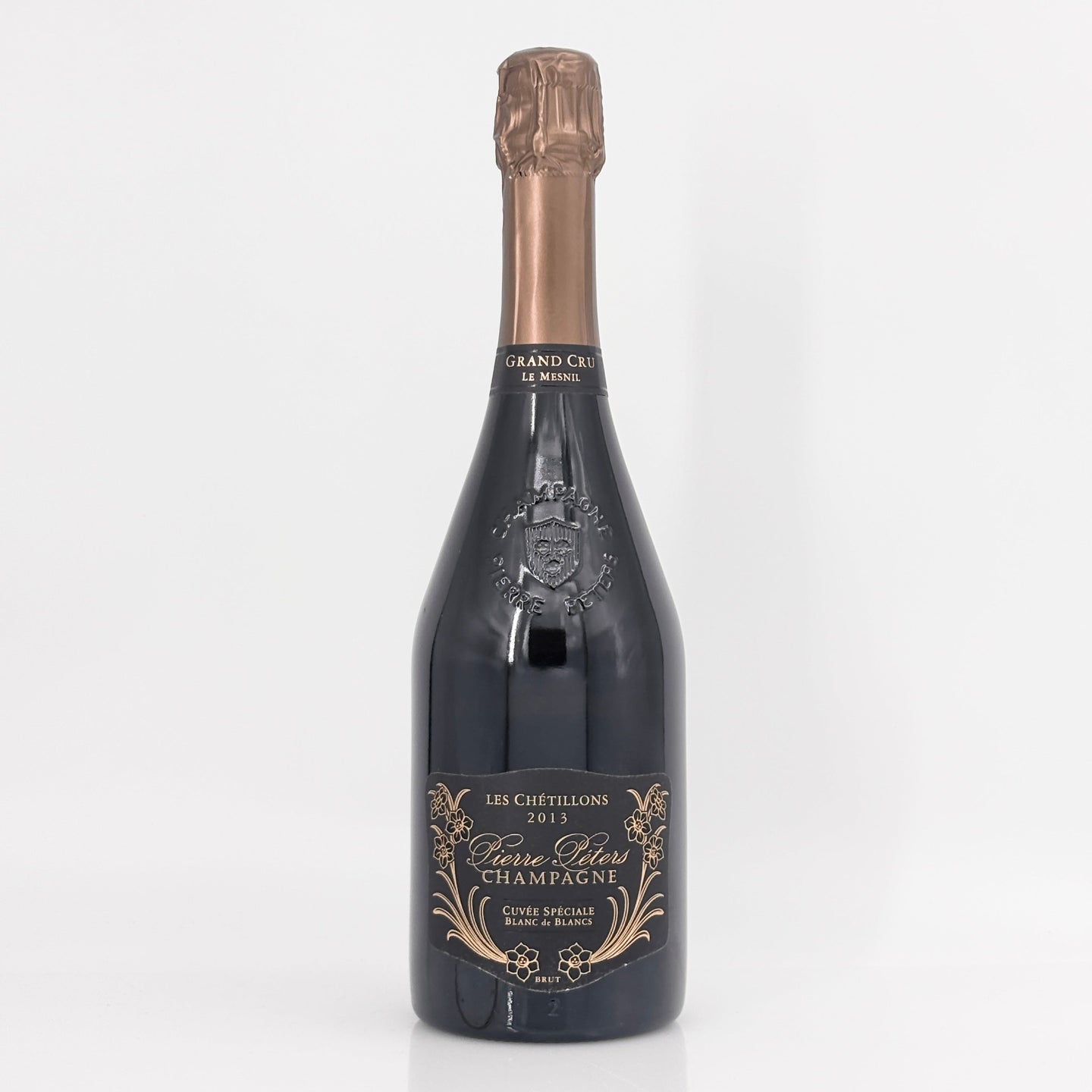 Bottle of champagne with a decorative label on a white background