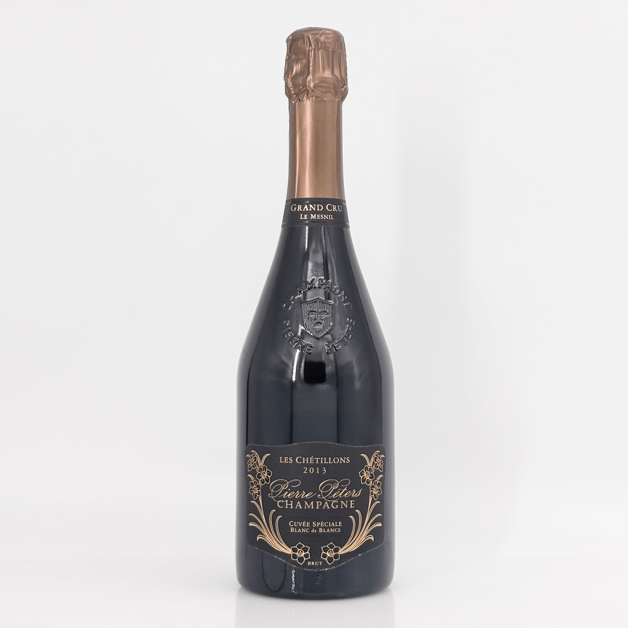Bottle of champagne with a decorative label on a white background