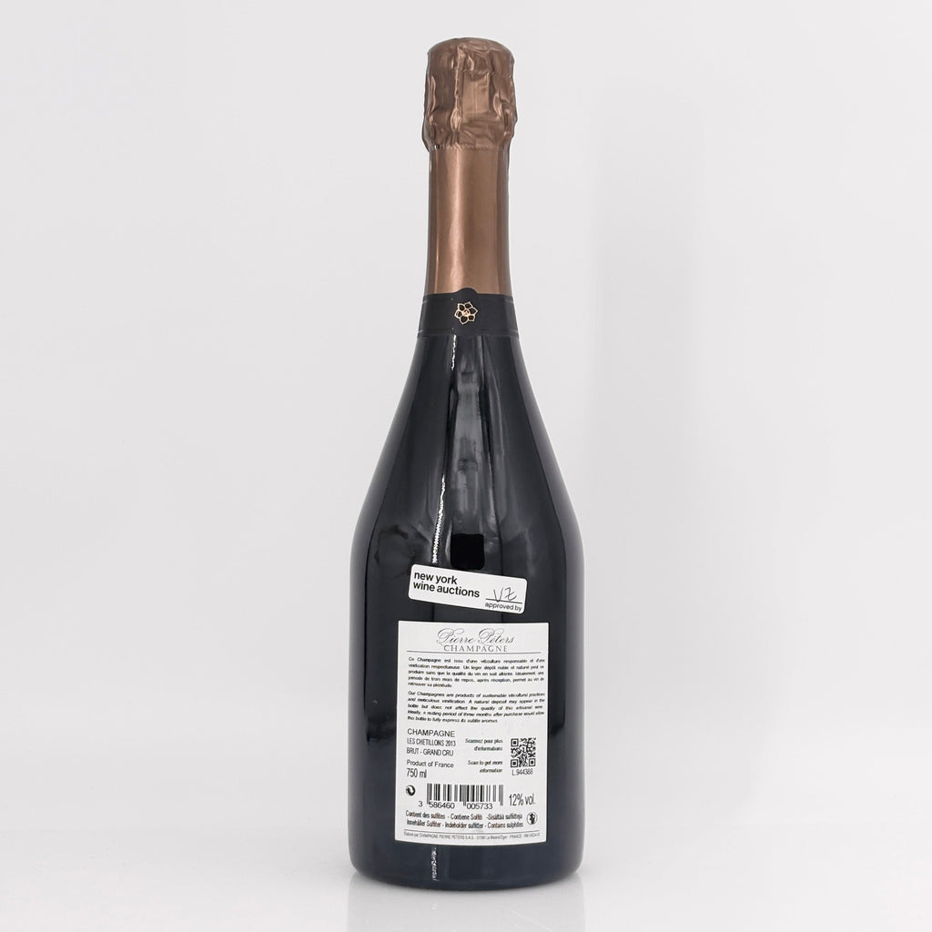 Bottle of champagne with a visible label on a white background