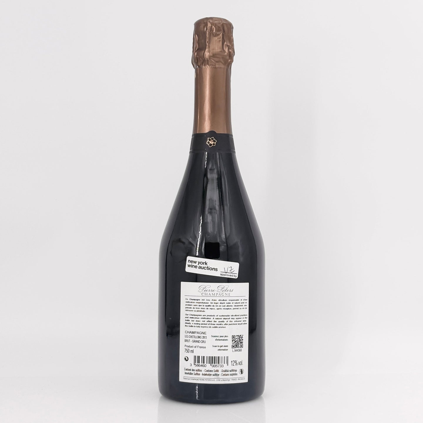 Bottle of champagne with a visible label on a white background