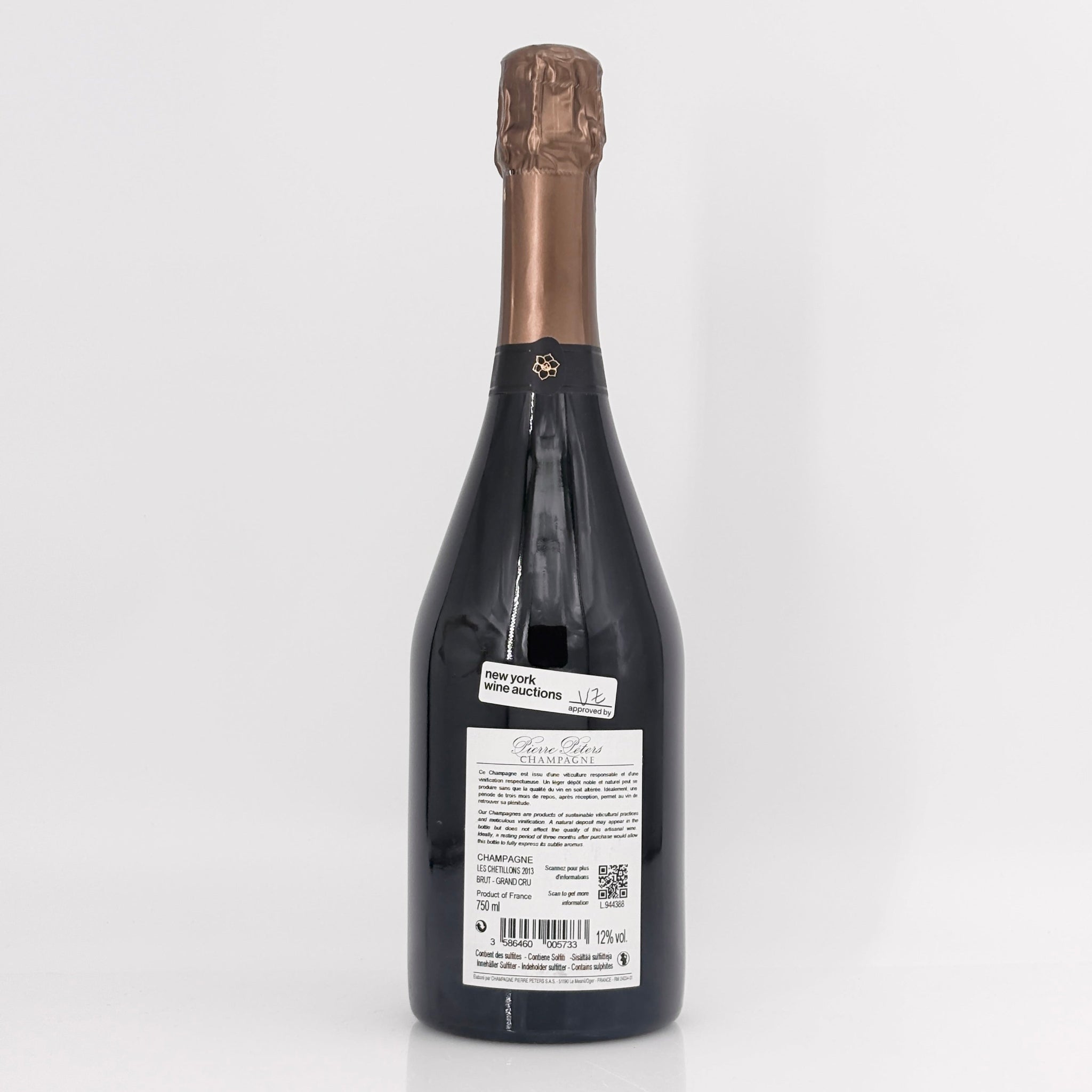 Bottle of champagne with a visible label on a white background