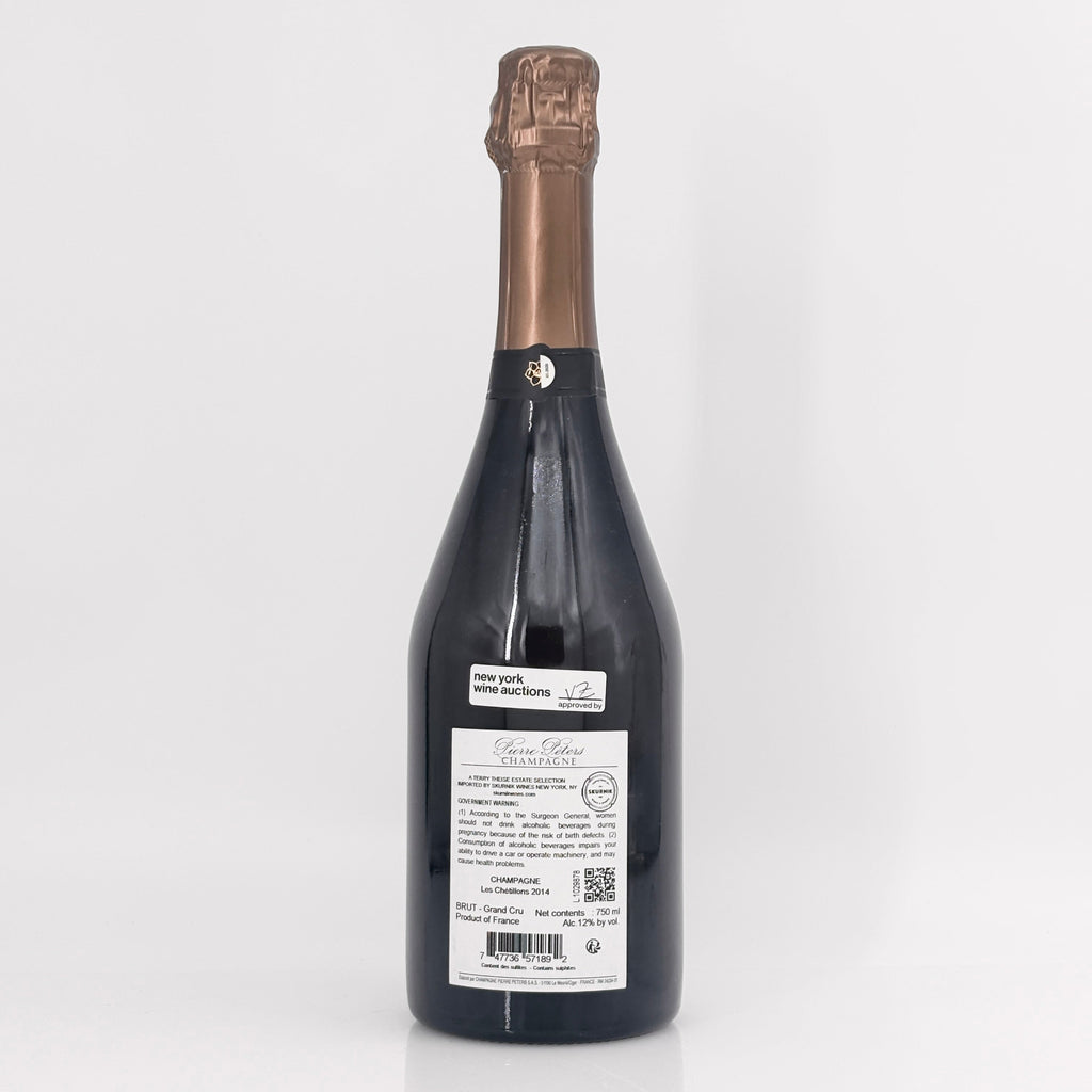 Bottle of champagne with a visible label on a white background