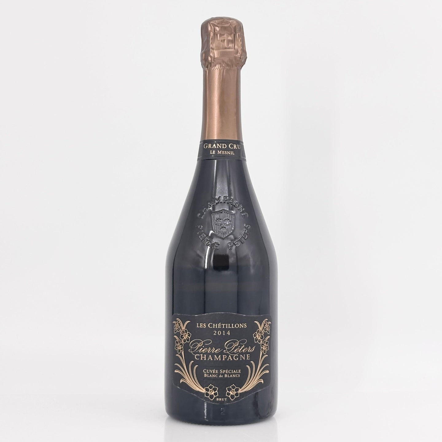Bottle of champagne with a detailed label on a white background