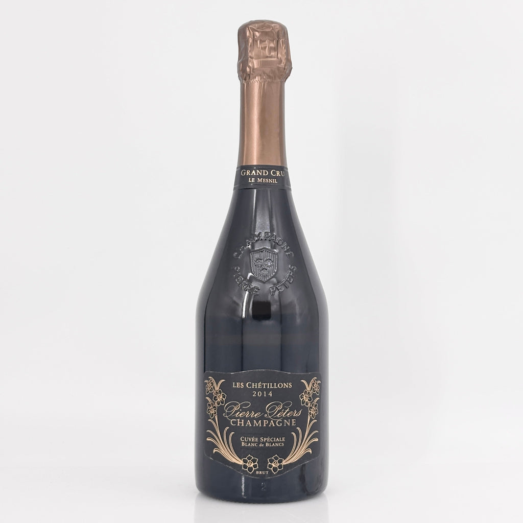 Bottle of champagne with a detailed label on a white background