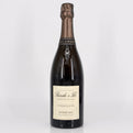 Bottle of champagne with a visible label on a white background 