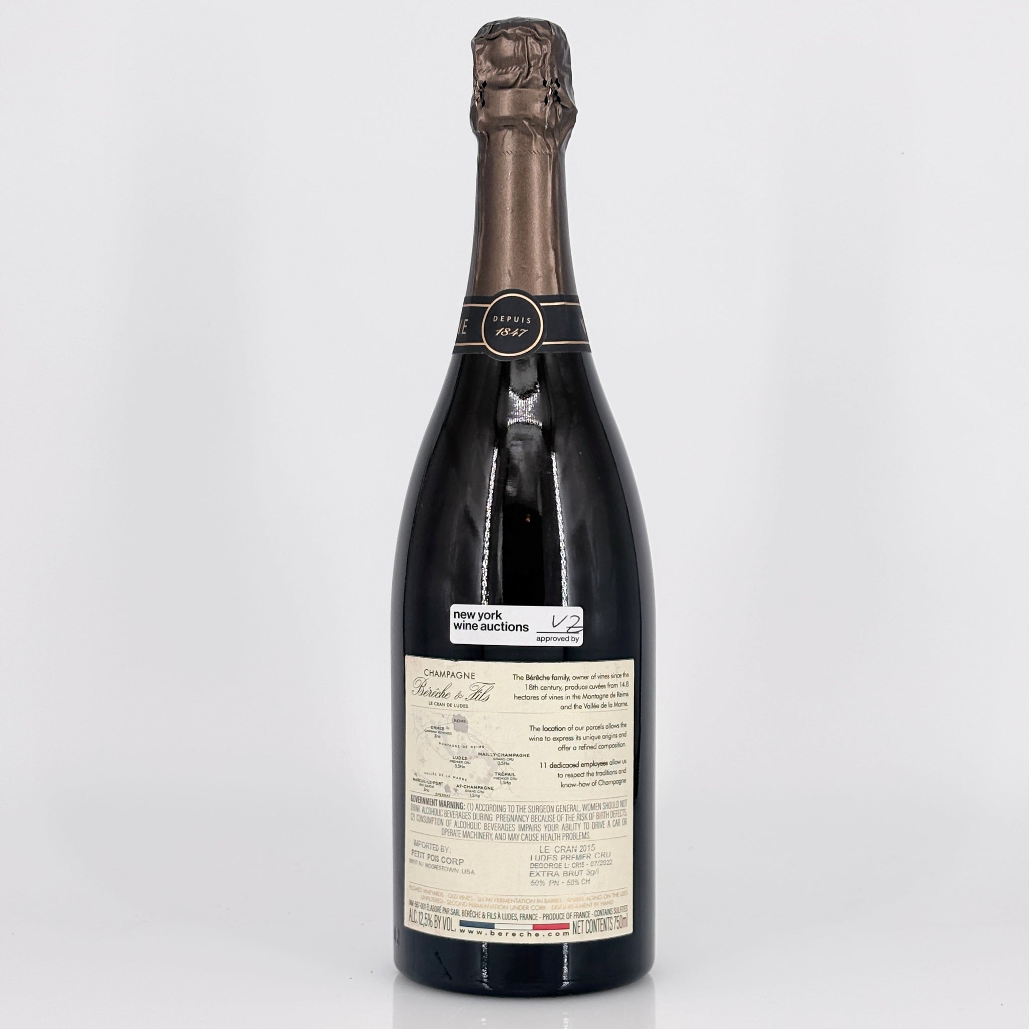 Bottle of wine with a visible label on a white background