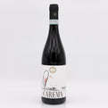 Wine bottle with a white label on a light gray background