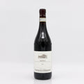 Wine bottle with a white label on a light gray background