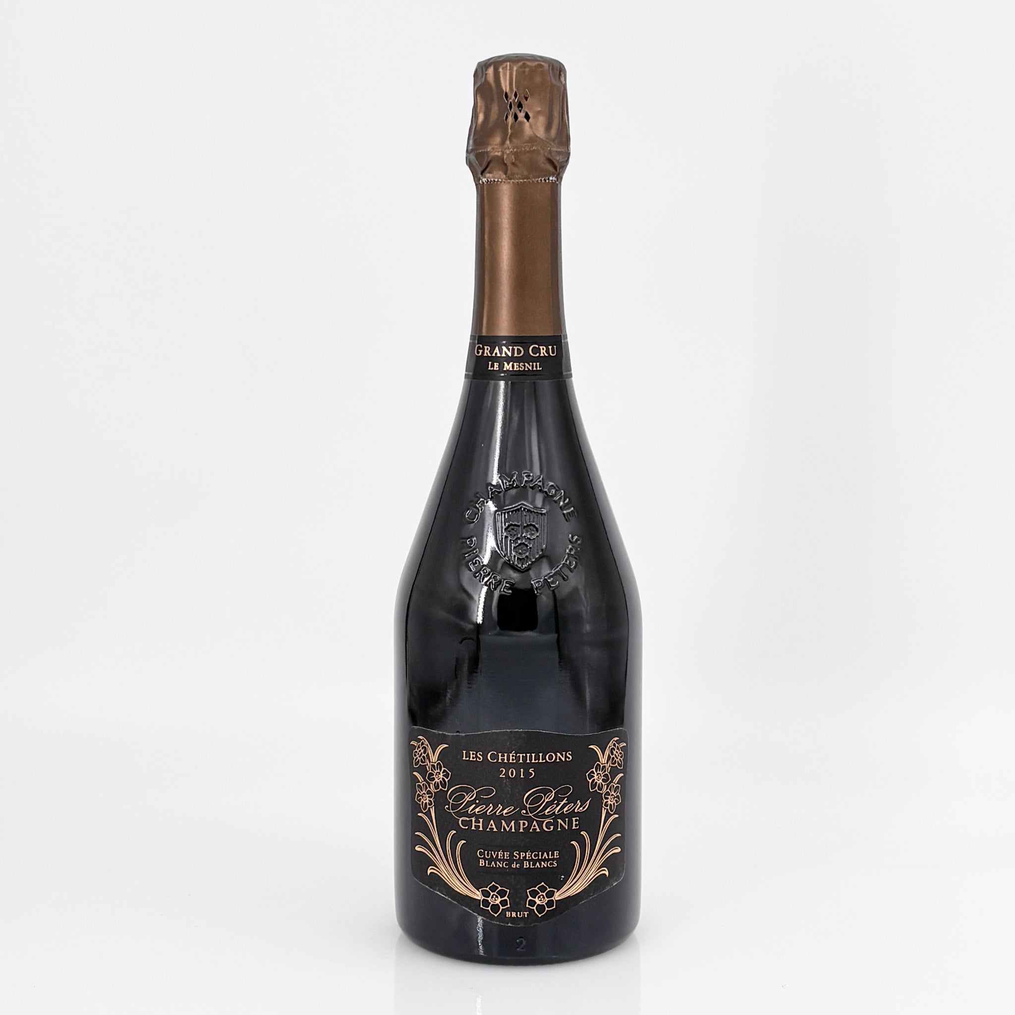 Bottle of champagne with a detailed label on a white background