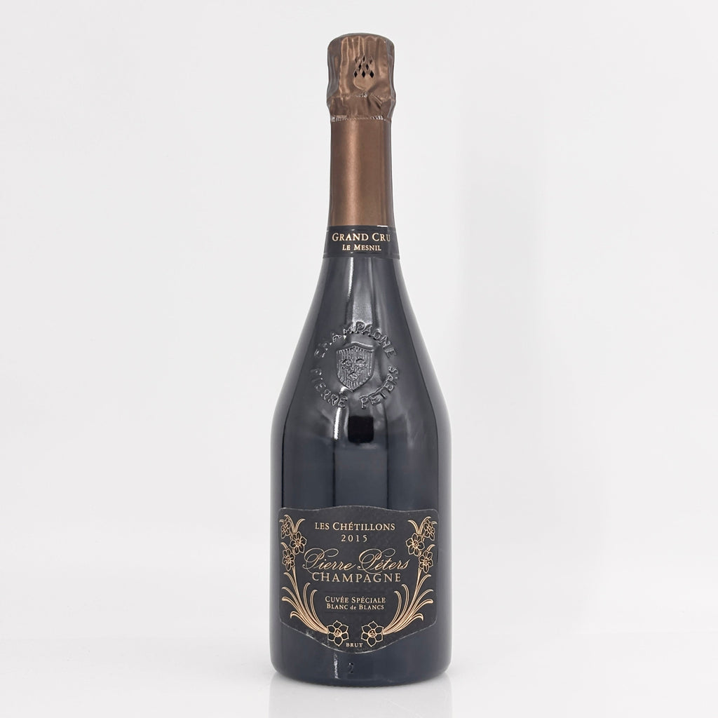 Bottle of champagne with a decorative label on a white background