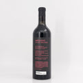 Wine bottle with 'Impulsivo' label on a white background