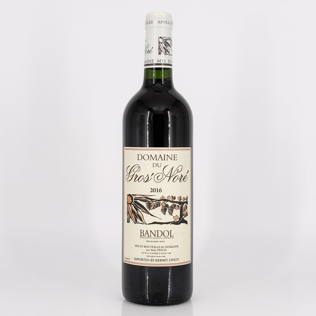 Red wine bottle with a visible label on a white background