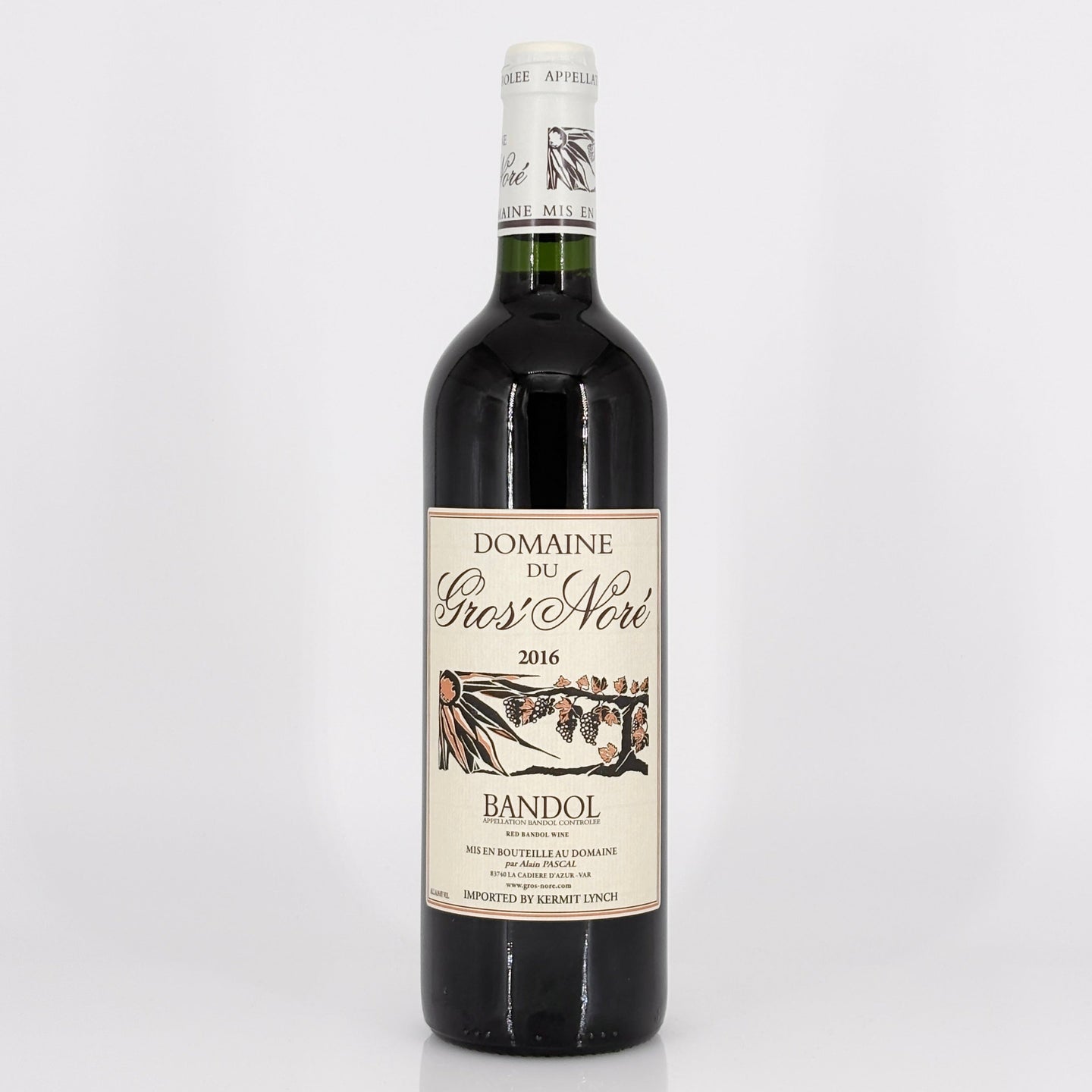 Red wine bottle with a visible label on a white background