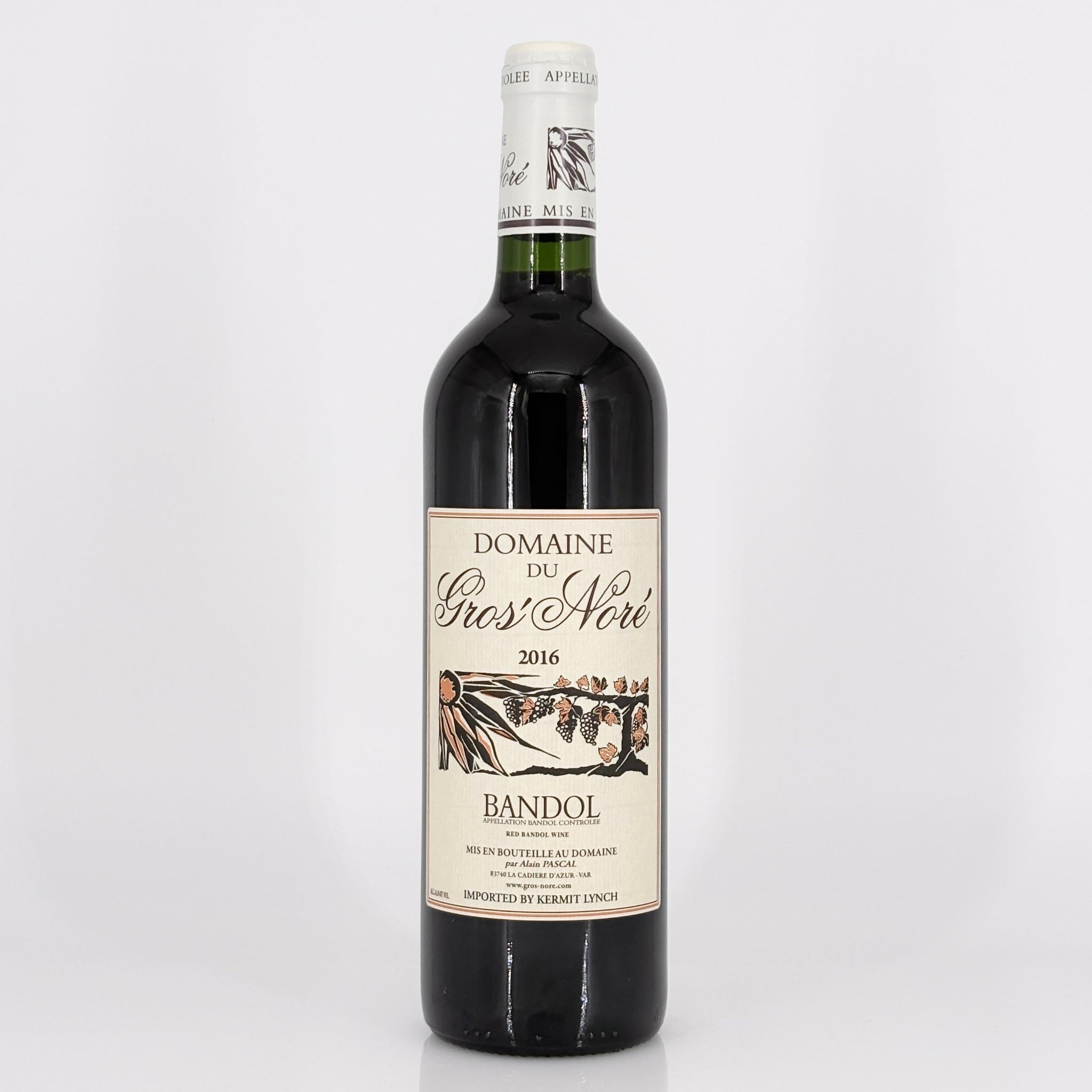 Red wine bottle with a visible label on a white background