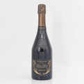 Bottle of champagne with a decorative label on a white background
