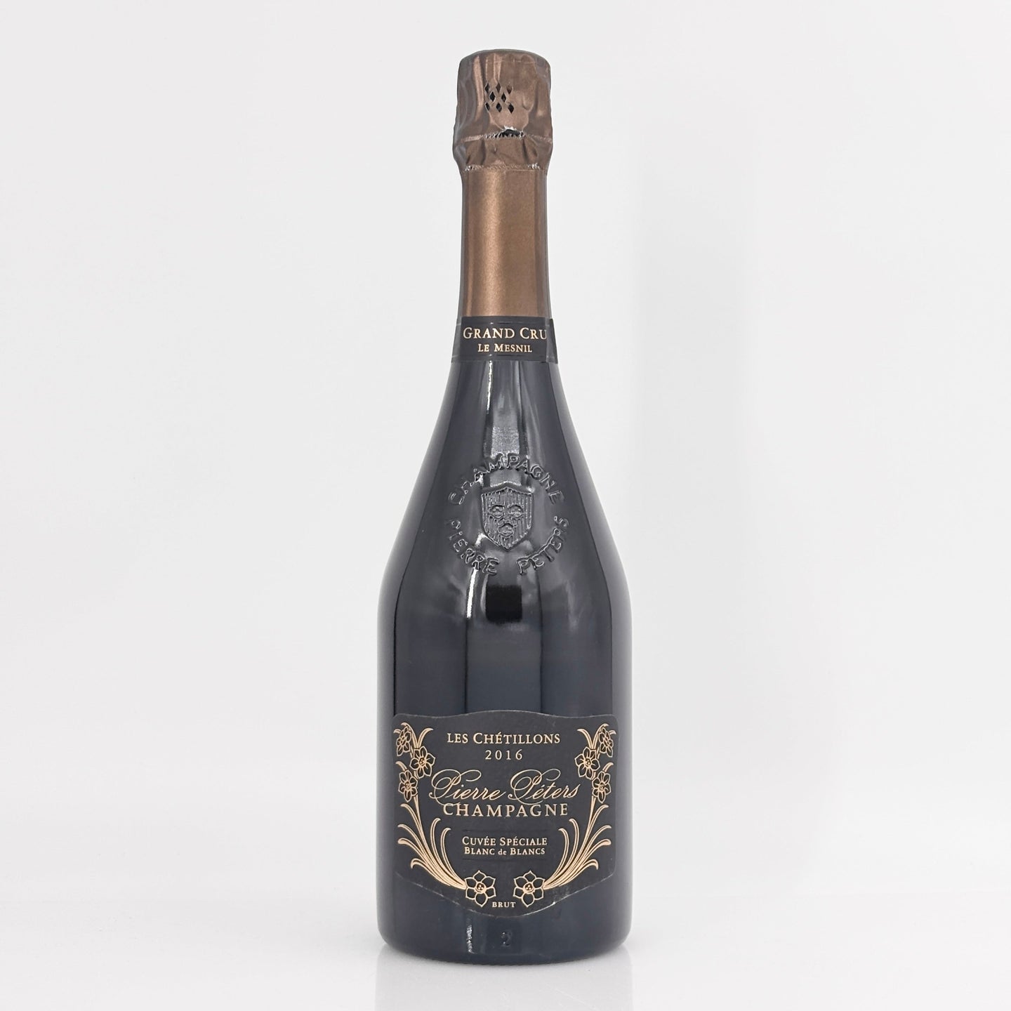 Bottle of champagne with a decorative label on a white background