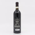 Red wine bottle with label on a white background