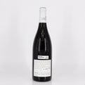 Wine bottle with a visible label on a white background