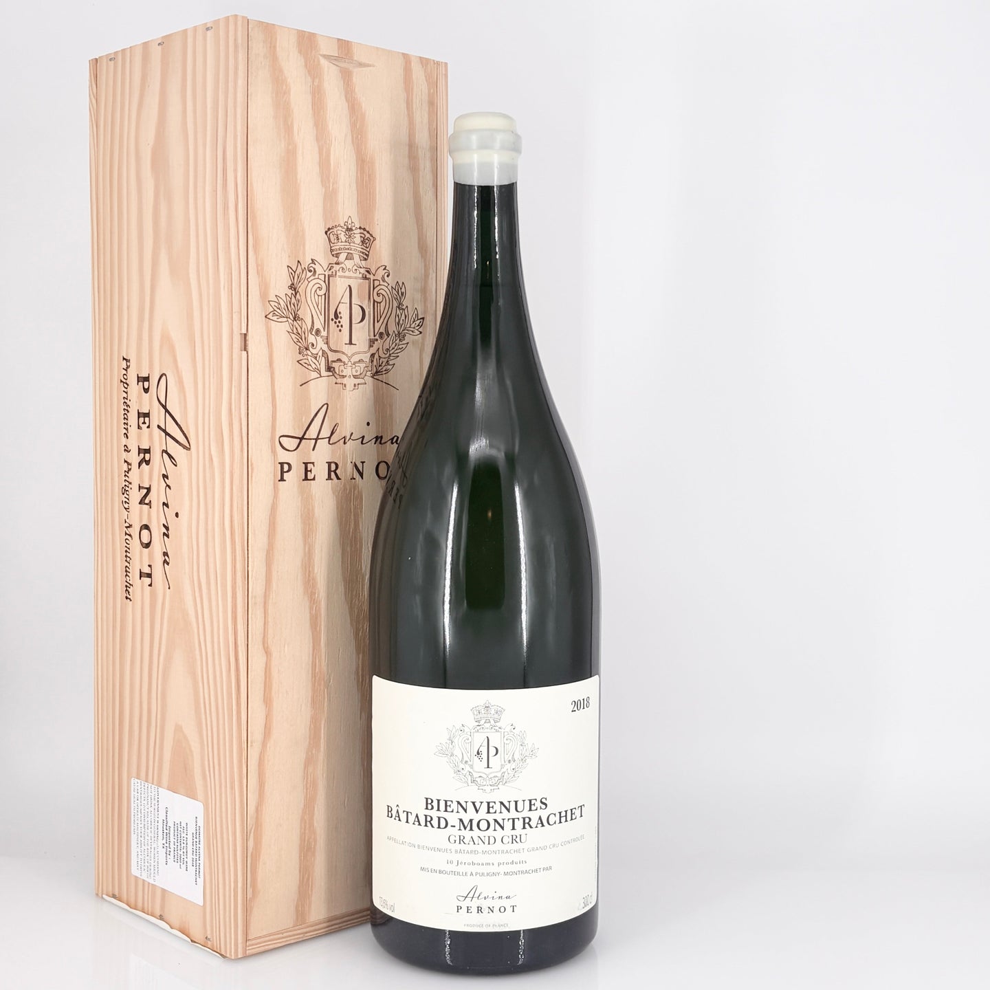Bottle of wine with a wooden box labeled 'Alvina Pernot' on a white background