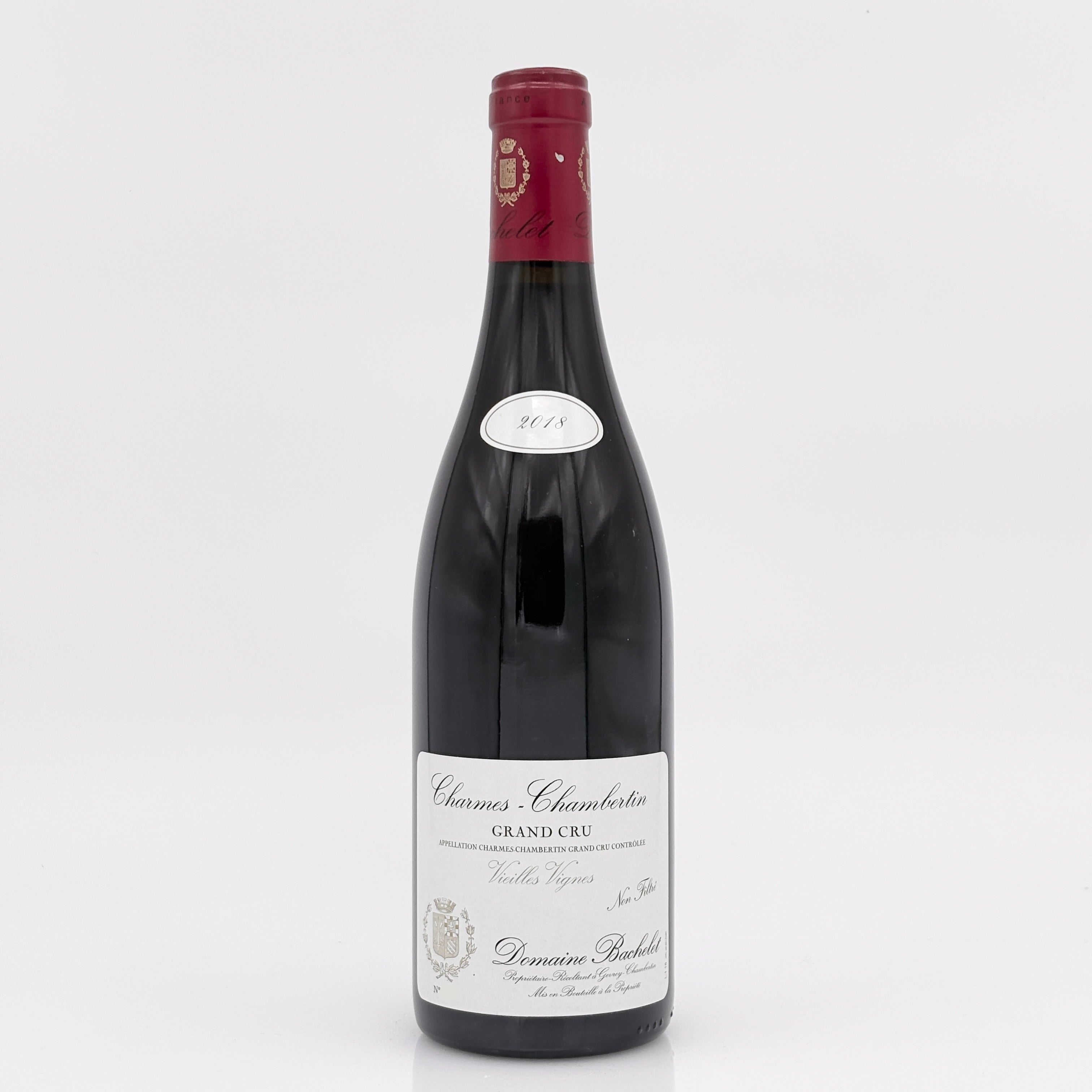 Wine bottle with a red label on a white background