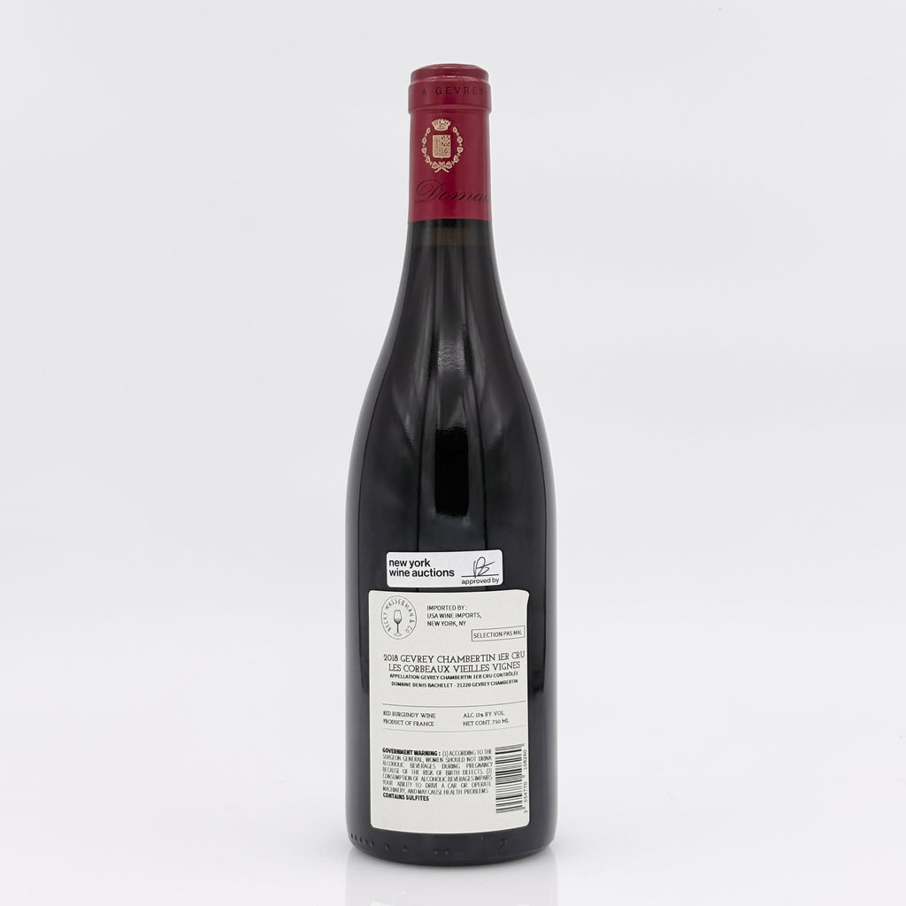 Red wine bottle with a visible label on a white background