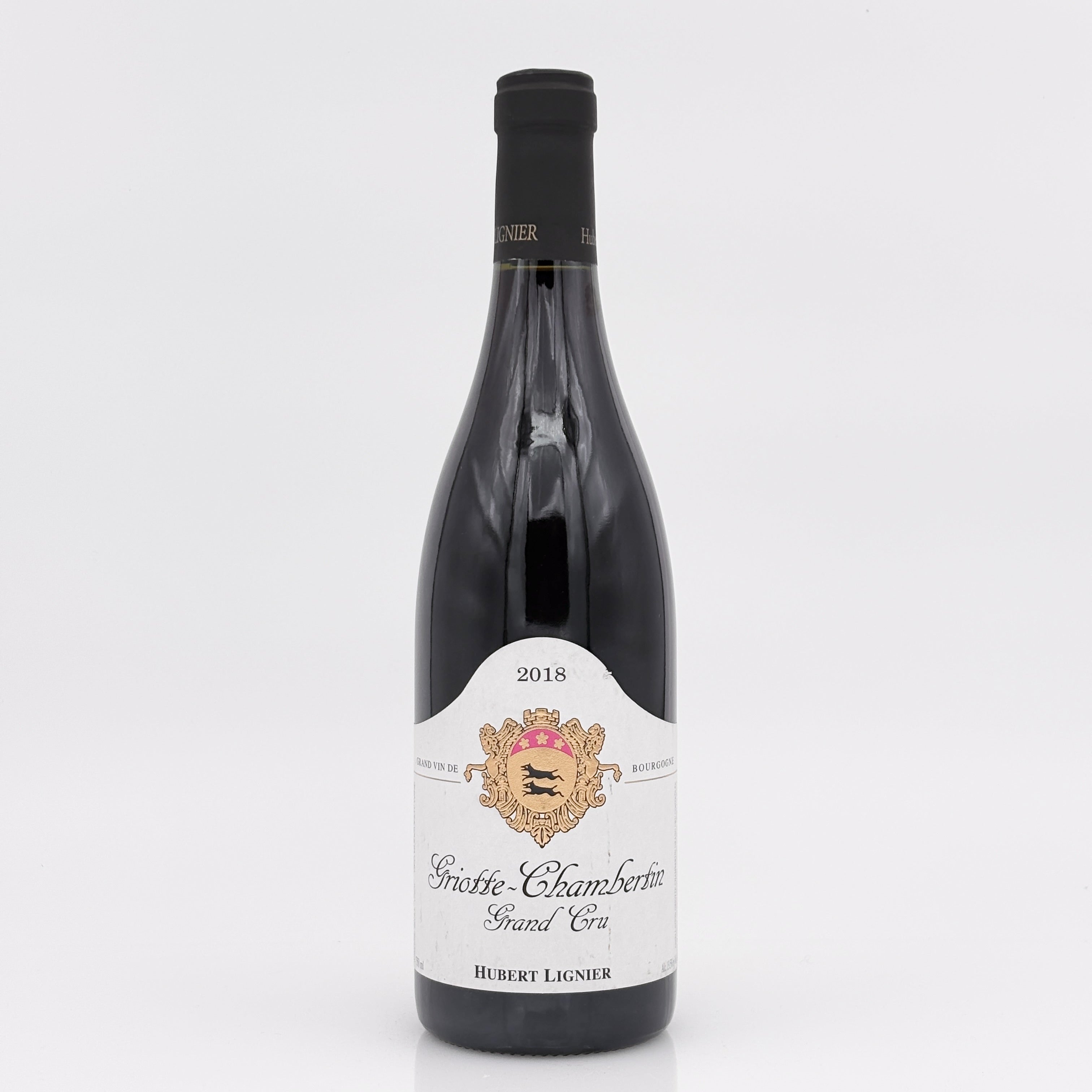Wine bottle with a white label on a light gray background