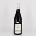 Wine bottle with a white label on a light gray background