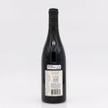 Wine bottle with yellow label on white background