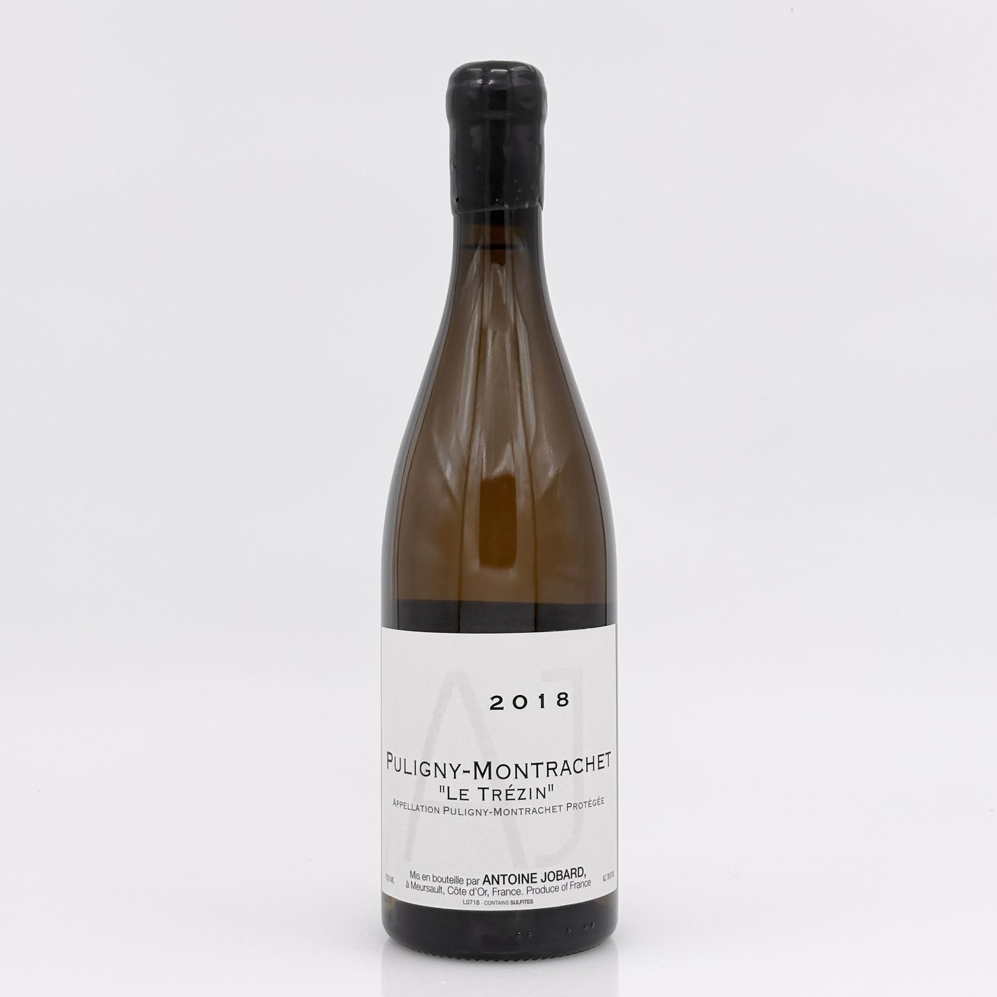 Wine bottle labeled 'Puligny-Montrachet' on a white background