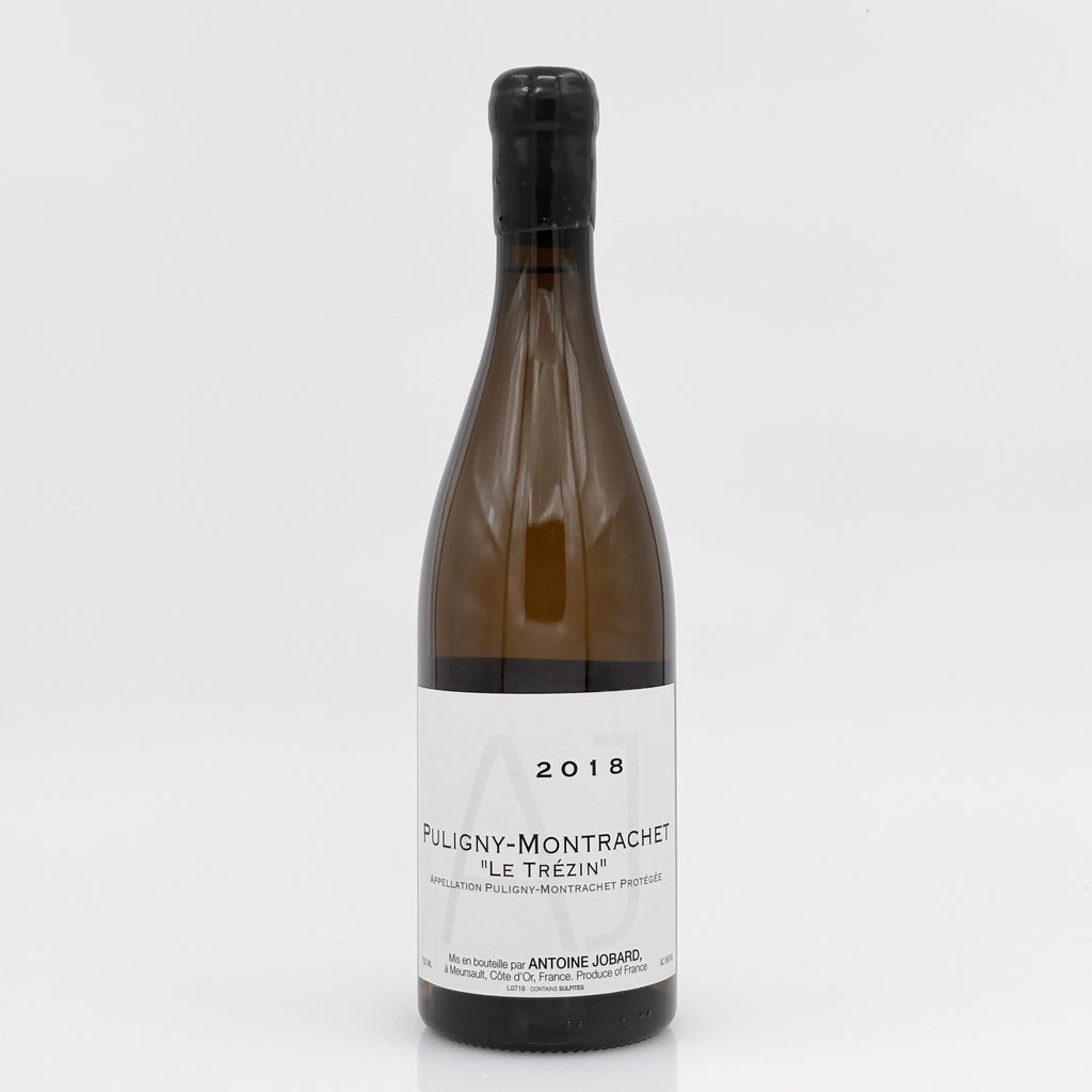 Wine bottle labeled 'Puligny-Montrachet' on a white background