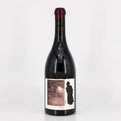 Wine bottle with a label featuring a silhouette on a white background