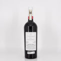 Bottle of red wine with a label on a white background