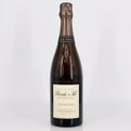 Bottle of champagne with a visible label on a white background