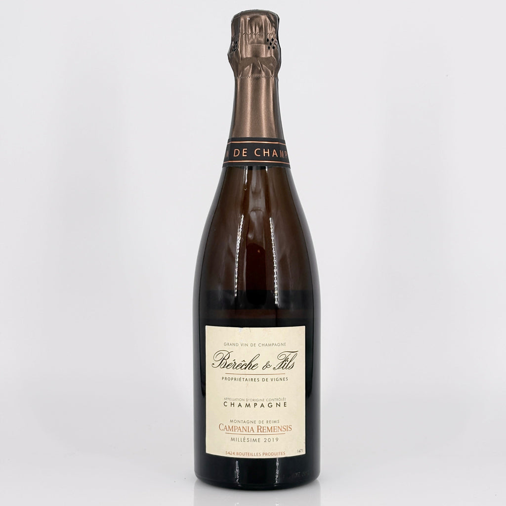 Bottle of champagne with a visible label on a white background