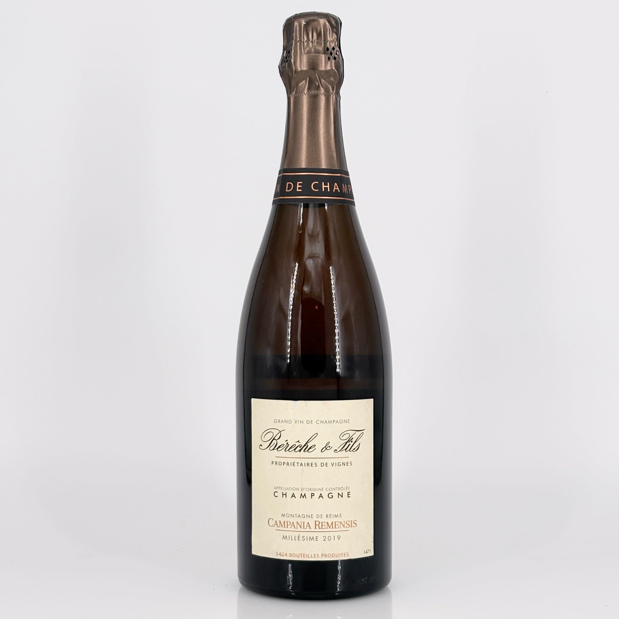 Bottle of champagne with a visible label on a white background