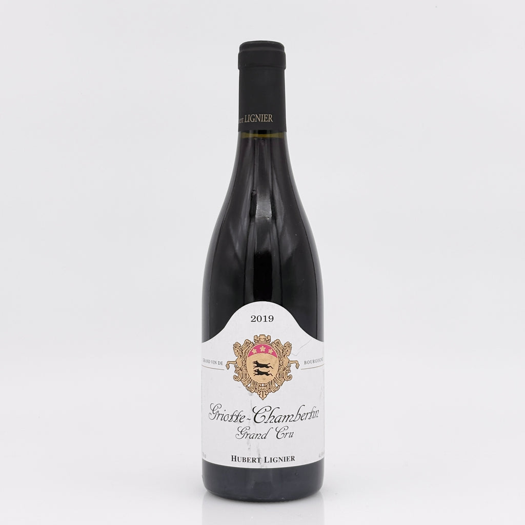 Wine bottle with a white label on a light gray background