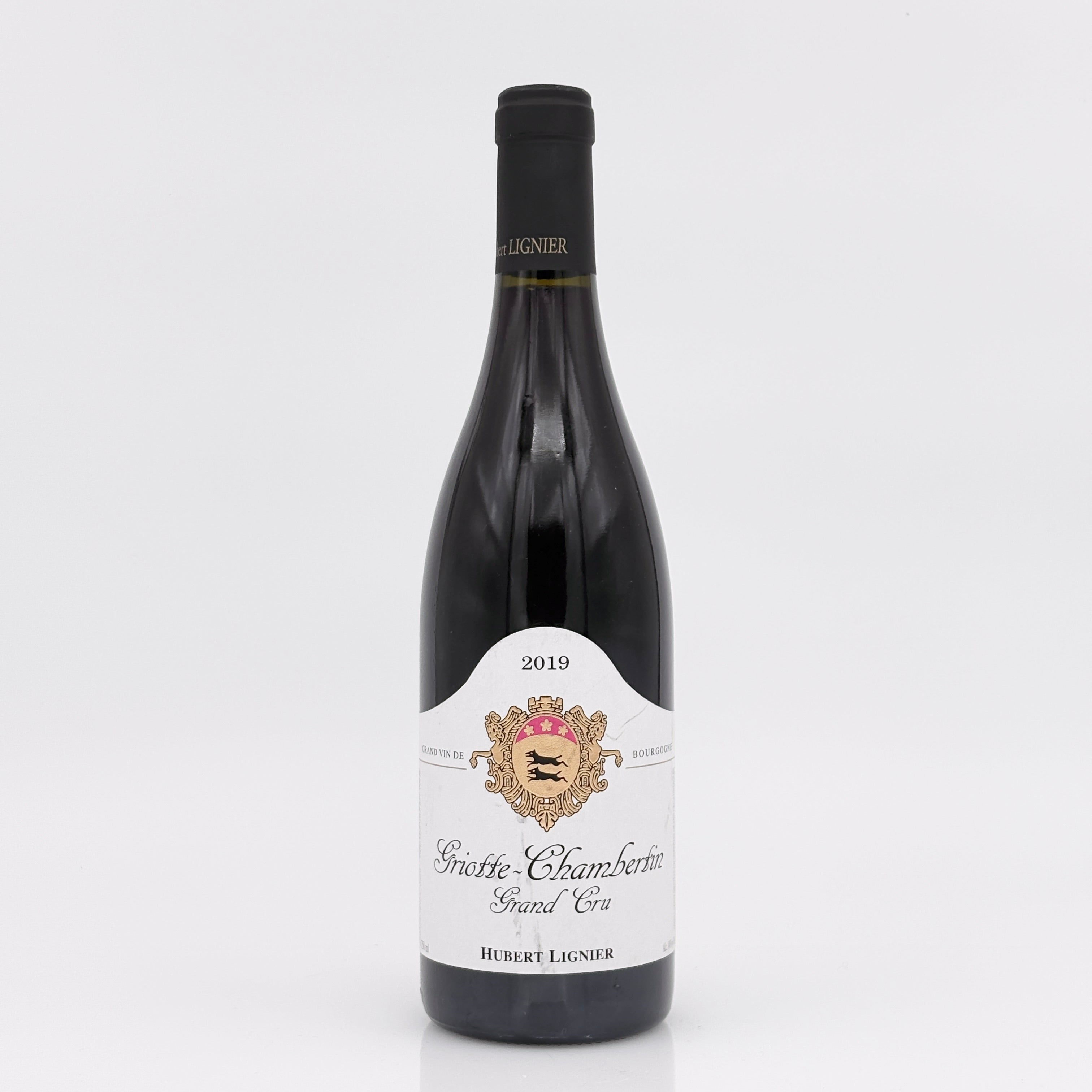 Wine bottle with a white label on a light gray background