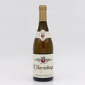 Bottle of L'Hermitage wine with a visible label on a white background
