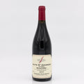 Red wine bottle with a visible label on a white background