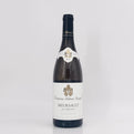 Wine bottle with a visible label on a light gray background