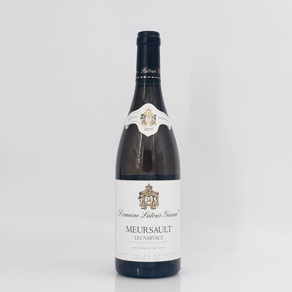 Wine bottle with a visible label on a light gray background