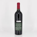 Red wine bottle with a visible label on a white background