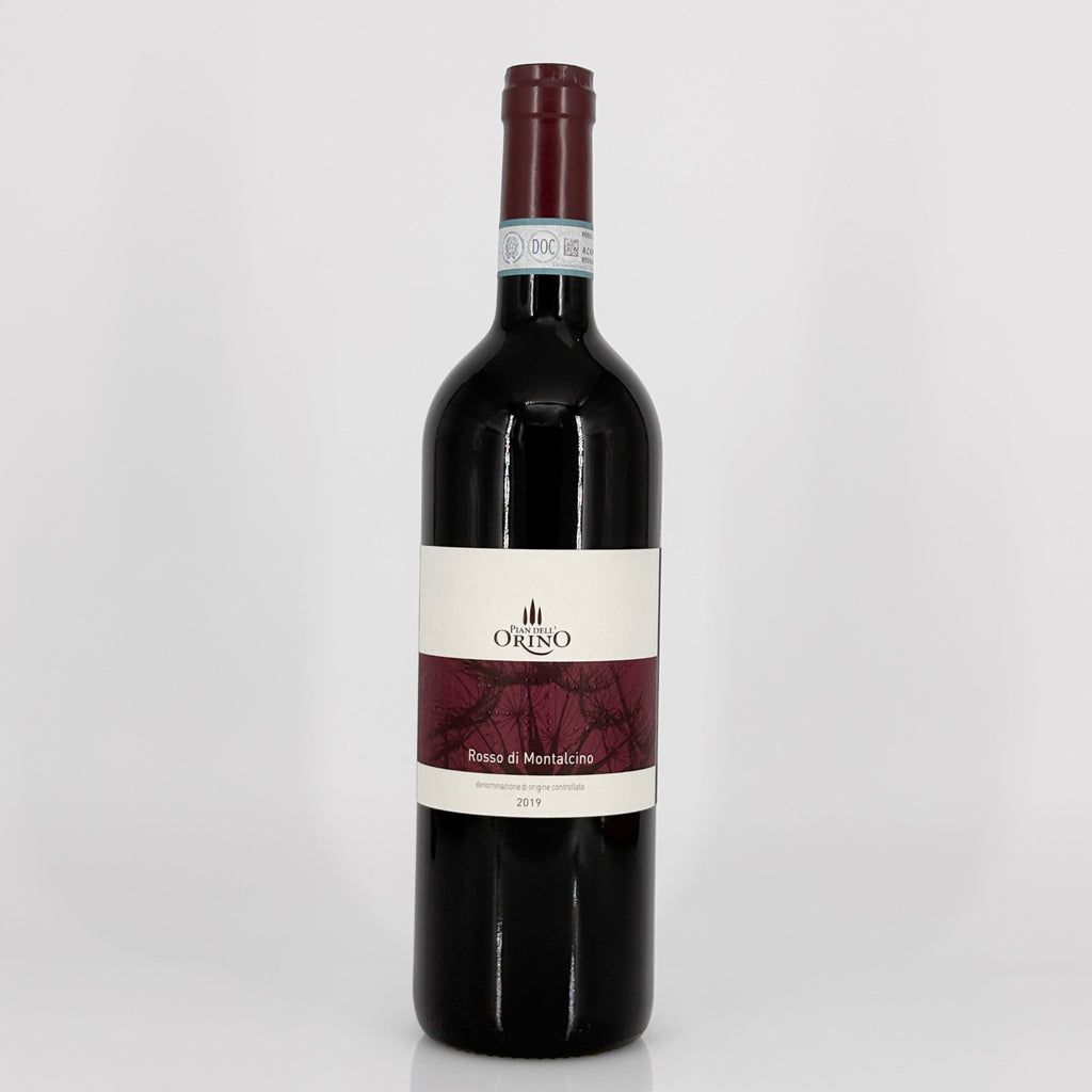 Red wine bottle with a visible label on a white background