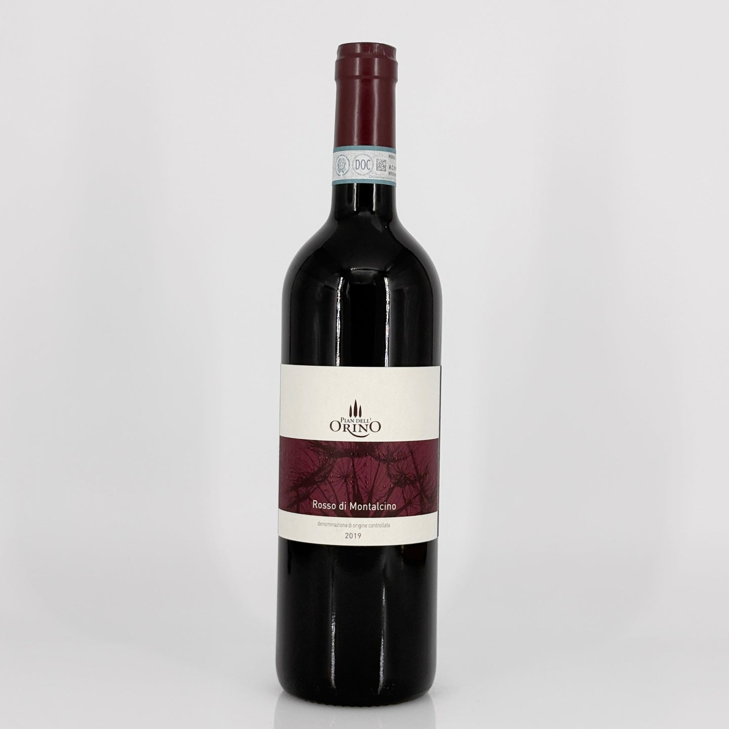 Red wine bottle with a visible label on a white background