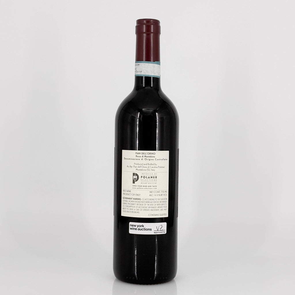Red wine bottle with a label on a white background
